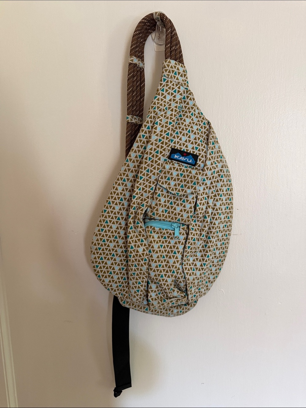 Kavu Triangle Print Sling Backpack in Tan, Brown, Teal